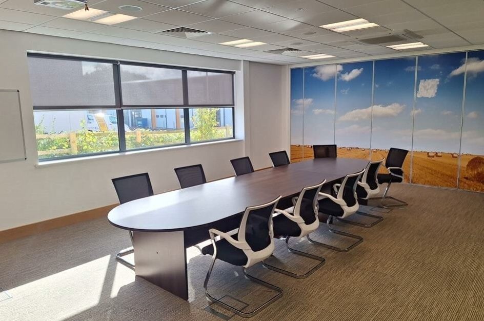 Office with table and chairs in the middle
