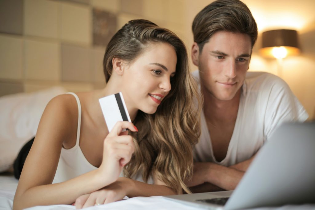 Couple with credit card and laptop
