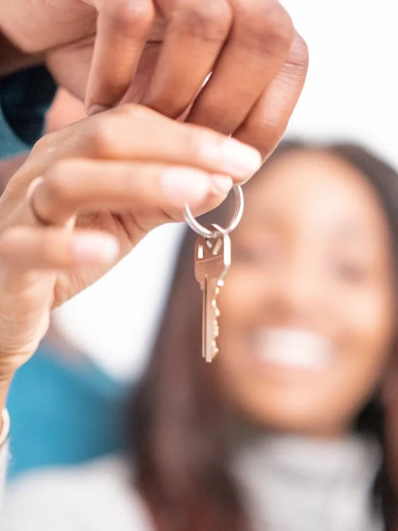 woman holding housekey